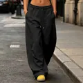 Detailed view of black wide-leg sweatpants with high waist and drawstring fit - S / Bottoms / Black