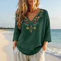 Detail of heavy floral embroidery on a dark green V-neck cotton linen summer top - Dark Green