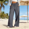 Full detail of grey high-waist wide-leg trousers featuring a casual drawstring design - S / Bottoms / Dark Gray