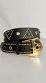 Closeup of punk style black leather belt featuring gold studs, rhinestones and metal buckle. - 110cm / Black Gold Clasp
