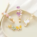 Ensemble de pinces à cheveux dorées avec coquillage, fleurs, lapin et papillon pastel - Combinaison de Conque, Fleur, Papillon et Lapin