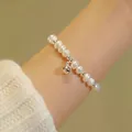 Elegant freshwater pearl beaded bracelet with cute silver bell pendant for women style - Pearl Bell Beaded Style (MY35834)