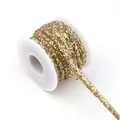 Close-up of gold sequin PVC braid cord, detailed texture of sparkling DIY hair accessories trim. - Gold