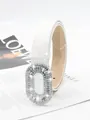 Close-up detail of a white glitter belt featuring a sparkling rhinestone buckle and texture. - 2.8cm Oval Buckle / White
