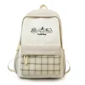 Cute Japanese style college backpack for women, beige school bag with plaid front pocket. - Khaki