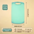 Durable light green plastic cutting board with TPR handle, dimensions 34.5 x 20.5 cm - M / Semi-transparent Blue