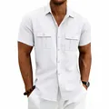 Detail view of men's white summer linen shirt featuring functional double chest pockets - S / Tops / White