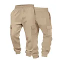 Close-up of men's waffle knit cargo joggers featuring side pockets and drawstring waist. - S / Bottoms / Khaki