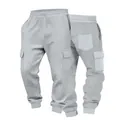 Macro detail of men's grey waffle knit cargo joggers showing fabric texture and pockets - S / Bottoms / Light Gray