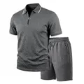 Detailed view of grey men's polo set featuring a refined diamond jacquard texture - Dark Gray