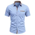 Close-up of light blue men's short sleeve shirt featuring a classic plaid collar detail - S / Tops / Sky Blue