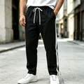 Men's stylish black casual sweatpants with white side stripes and adjustable drawstring - M / Bottoms / Black