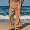 Breathable men's loose linen-texture pants in tan color shown on a sunny beach background - Earthy Yellow