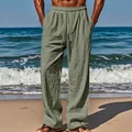 Detail view of men's breathable sage green linen trousers on a sunny tropical beach - S / Bottoms / Army Green