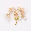 Detailed vintage floral branch brooch featuring white flowers, green leaves and teardrop pearls - Yellow