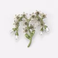 Detailed view of a vintage floral brooch with green stems and elegant hanging pearls - Light Gray