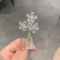 Detailed view of an elegant crystal flower vase brooch with sparkling rhinestones - Three Flowers Vase