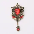 Vintage royal style brooch with large red teardrop rhinestone and green accents - Red