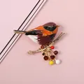 Colorful enamel bird brooch detail on a golden branch with sparkling rhinestones. - Brown Orange Bird (4#)