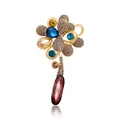 Elegant gold-toned flower brooch featuring blue rhinestones and a large brown crystal drop - Blue