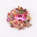 Ornate alloy brooch featuring a large pink oval crystal and colorful rhinestones - Rose Red