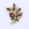 Elegant gold-tone alloy floral bouquet brooch featuring vibrant colorful glass crystals. - Coffee