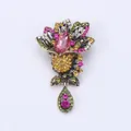 Vintage floral brooch featuring a pink teardrop crystal and colorful rhinestone accents - S4 Pink Main Stone