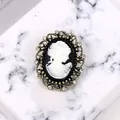 Elegant vintage Victorian style lady cameo brooch with rhinestone embellished gold frame - White