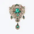 Exquisite vintage palace style hollow brooch featuring emerald green teardrop rhinestones - Green