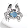 Elegant vintage silver-tone crab brooch featuring a blue crystal and sparkling rhinestones - Crab Style / Light Blue