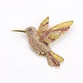Close-up of sparkling multi-colored rhinestone hummingbird brooch in vintage gold - Yellow Style (8684)