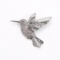 Close-up detail of hummingbird brooch with sparkling rhinestones and silver alloy base. - Black Style (8683)