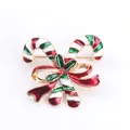 Prachtige kerstbroche met zuurstokmotief, een rode strik en fonkelende steentjes - Zuurstok Strik Stijl (C3-2-7921)