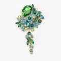 Exquisite vintage tassel brooch featuring emerald green and teal glass rhinestones - Green
