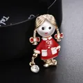 Detailed macro view of a cute cartoon girl brooch with a pearl head and red enamel coat - Red