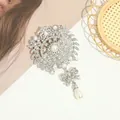 Elegant silver-toned brooch with sparkling rhinestones and a dangling pearl teardrop - Silver Wheat Ear Bow Water Drop Pearl Brooch (E3-6-8978)