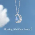 Elegante collar con colgante de estrella y luna plateado y cristal de lágrima azul - Embalaje Simple / Luna Fugaz sobre el Agua