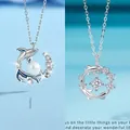 Elegante sterling zilveren walvis ketting met witte parel en fonkelende zirkoon details - Walvisval en Dolfijn Combo (Eenvoudige Verpakking)