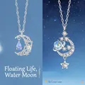 Elegante zilveren ster- en maan-hanger ketting met sprankelende zirkoon en blauw kristal - Zwevende Maan en Dromerige Melkweg / Eenvoudige Verpakking