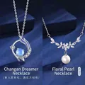 Elegante zilveren hanger ketting met maansteen en parelmoer bloemmotieven - Paars Emaille Ster & Bloementak Parel Stijl (Geschenkdoos)