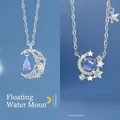 Elegante zilveren ster en maan ketting met blauwe kristalaccenten voor vrouwen - Geschenkdoos / Zwevende Maan en Sterren Rond de Maan