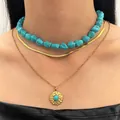 Bohemian layered necklace set featuring turquoise beads and gold-toned chains with pendant - Bohemian Three-Layer Layering Style (5569)