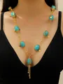 Ethnic bohemian style crackle turquoise oval bead necklace with gold tassel pendant - Vintage Hollow Flower Tray Tassel Style (DZ-603)