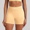 High-waisted seamless yoga shorts in soft apricot color for butt-lifting workout - Peach Orange