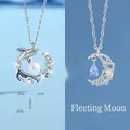 Elegante zilveren kettingen met walvis parel hanger en halve maan waterdruppel hanger - Walvisval + Drijvende Watermaan
