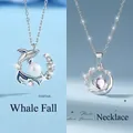 Elegante zilverkleurige kettingset met walvis- en hemelplaneet hangers voor dames - Walvisval + Pluto