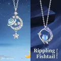 Elegante zilverkleurige ster en maan ketting met zeemeerminstaart hanger cadeau. - Dromerige Sterrenrivier & Rimpelende Vissenstaart