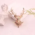Close-up of a vintage golden stag head brooch with intricate textured antler details. - Gold Stag Head (Q8-6-7523) / Gold