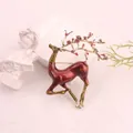Detailed view of elegant red enamel deer brooch with golden antlers and flower accents. - Red Enamel Gold Antler Deer (K7-2-3017)