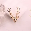 Detailed view of an elegant golden deer head brooch accessory for Christmas outfits - Polished Gold Stag Head (H7-3-2684) / Bright Gold